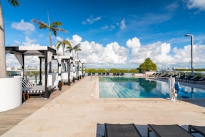 Outdoor pool, open 9:00 AM to 7:00 PM, free cabanas, pool umbrellas