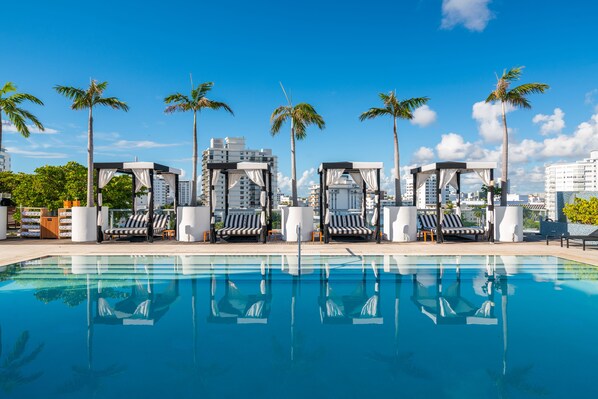 Outdoor pool, open 9:00 AM to 7:00 PM, free cabanas, pool umbrellas