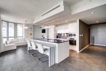 Two Bedroom Suite with Balcony | Private kitchen | Coffee/tea maker, highchair at Boulan South Beach