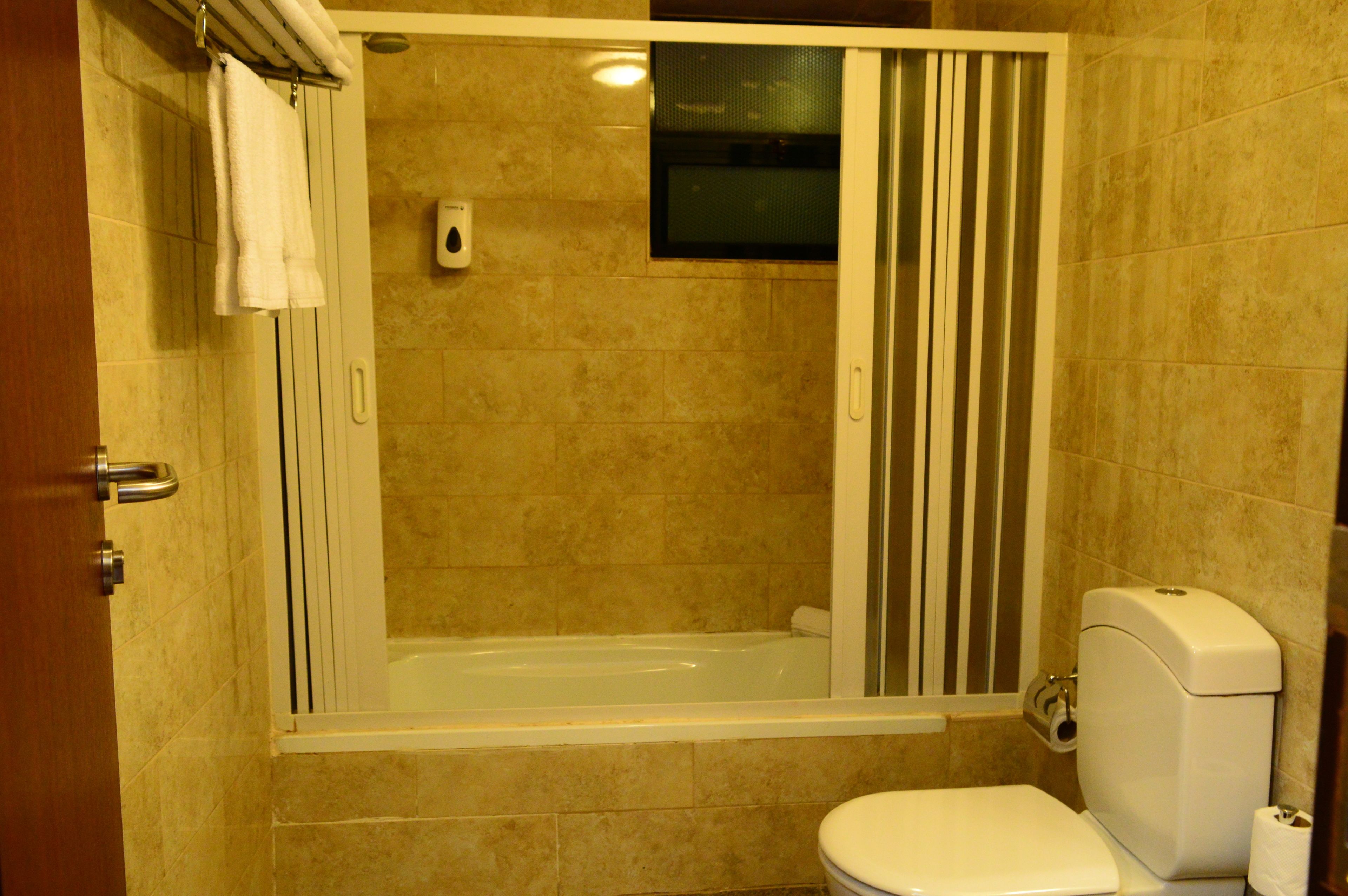 single room, city view | bathroom | shower, hair dryer, slippers, towels