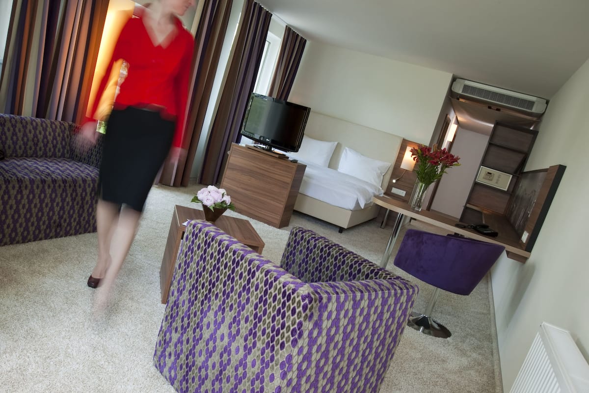 superior double room | living area | flat-screen tv