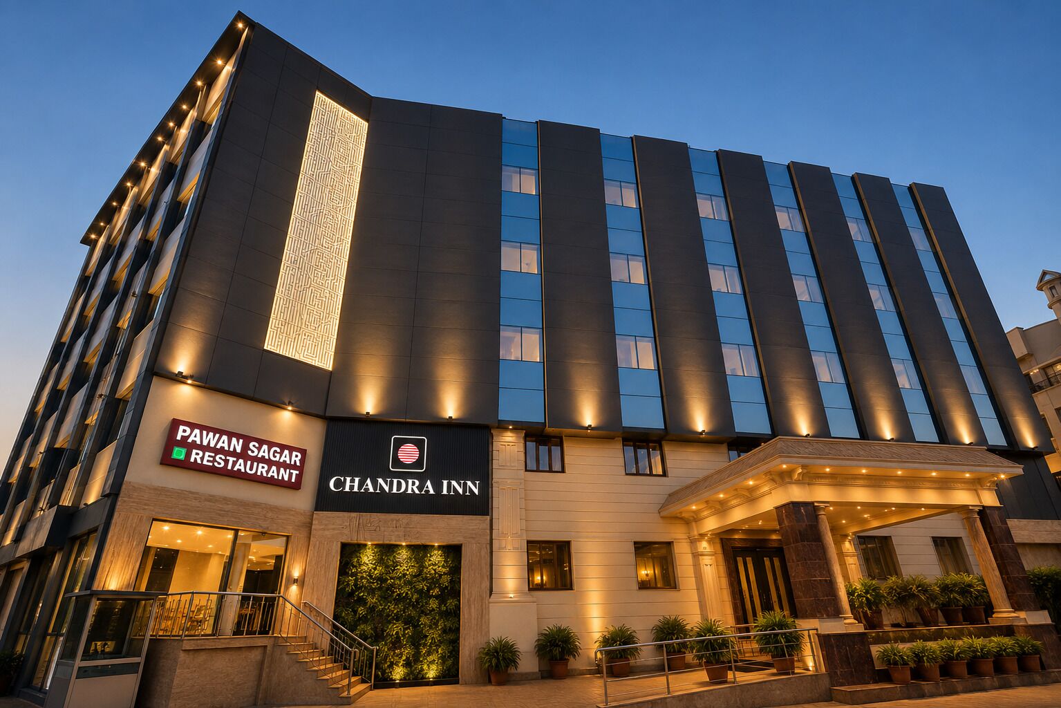 A modern hotel with a prominent entrance, a restaurant named 'PAWAN SAGAR,' and the 'CHANDRA INN' logo.