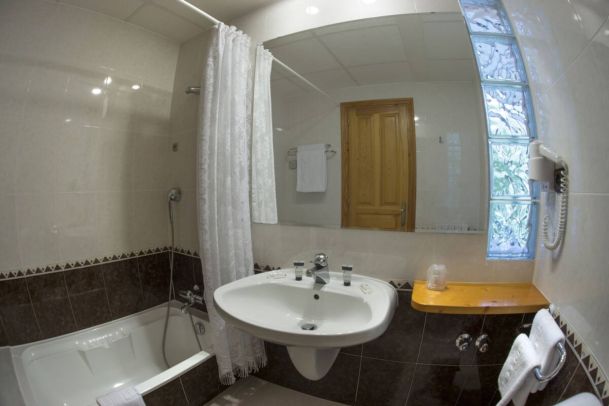 double room | bathroom | bathtub, deep-soaking bathtub, free toiletries, hair dryer