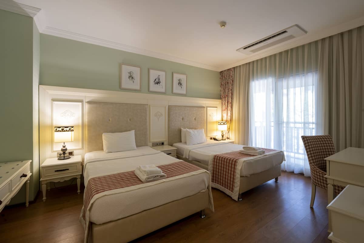 premium quadruple room | hypo-allergenic bedding, memory-foam beds, free minibar, in-room safe