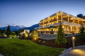 A modern hotel with a flat roof, multiple balconies, and outdoor seating areas. - Zugspitz Resort (Ehrwald)