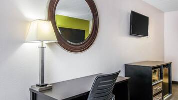 Premium bedding, desk, laptop workspace, blackout curtains