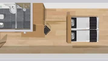 A modern hotel room layout with a bathroom, a seating area, and a television.