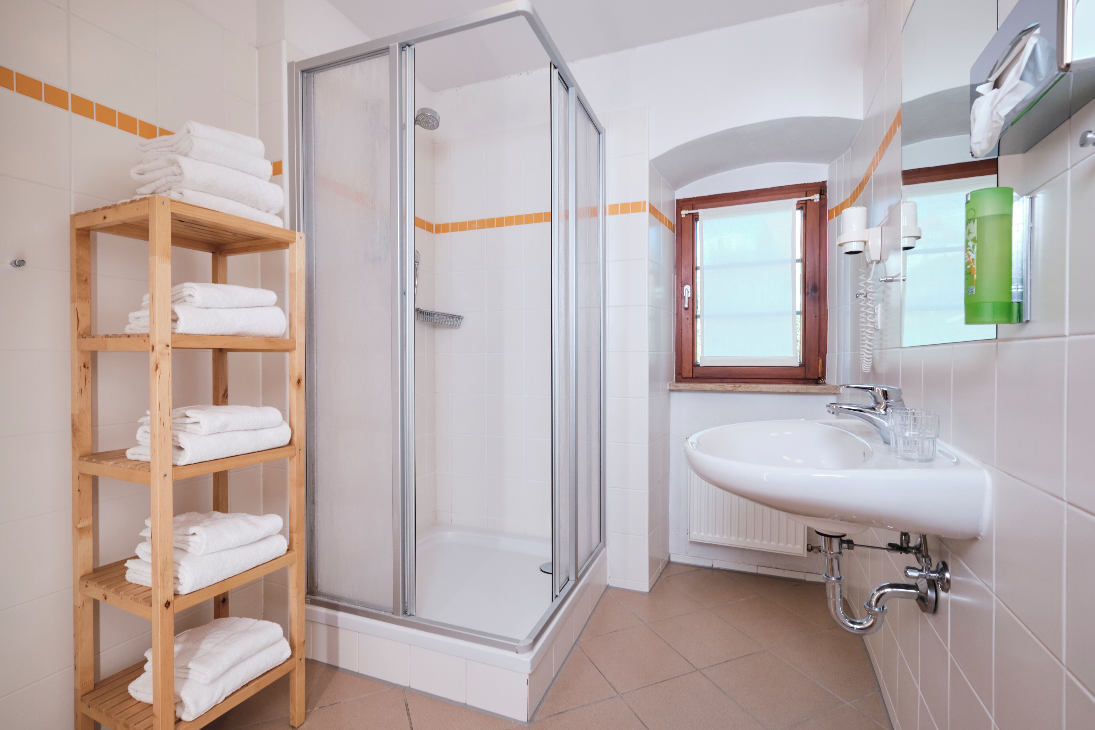 shower, free toiletries, hair dryer, towels