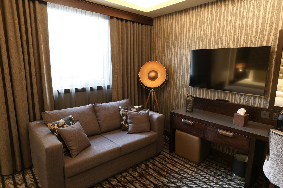 deluxe suite | desk, laptop workspace, blackout curtains, iron/ironing board