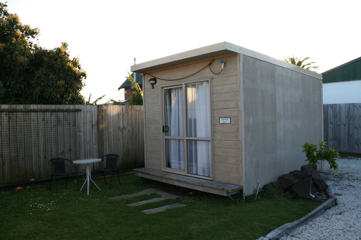Lonely Bay Cabin, Shared Bathroom | Property grounds