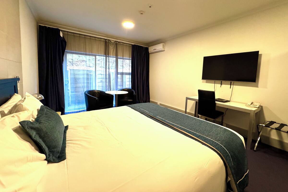 Executive Spa Studio | Premium bedding, desk, soundproofing, iron/ironing board