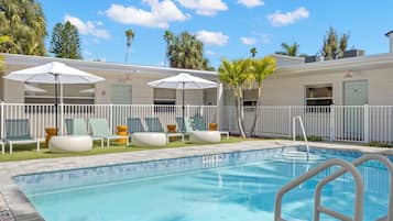 2 outdoor pools, a heated pool, open 8:00 AM to 8:00 PM, pool umbrellas