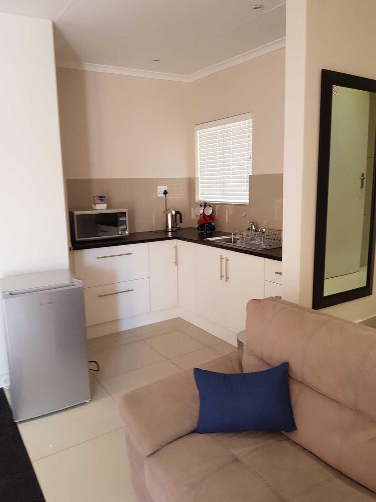 basic studio | living area | plasma tv