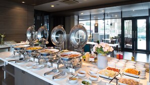 A buffet with various food options, including stir-fried cabbage, kimchi, and other dishes. - Simplitel (Karon)
