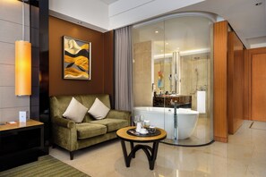 Deluxe Room, 1 King Bed | Bathroom | Combined shower/bathtub, rainfall showerhead, eco-friendly toiletries