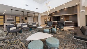 A spacious lobby with seating areas, a reception desk, and a modern chandelier. - Residence Inn Midland Marriott (Midland)