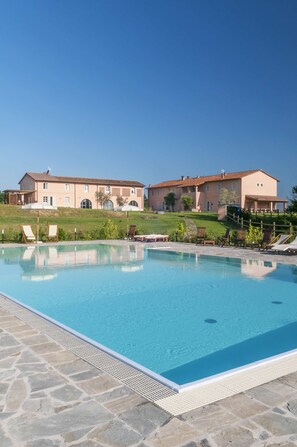 Seasonal outdoor pool, pool umbrellas, pool loungers