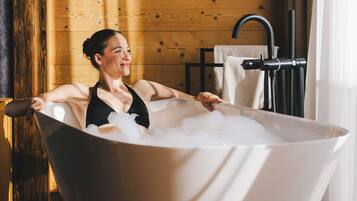 Designer toiletries, hair dryer, bathrobes, slippers