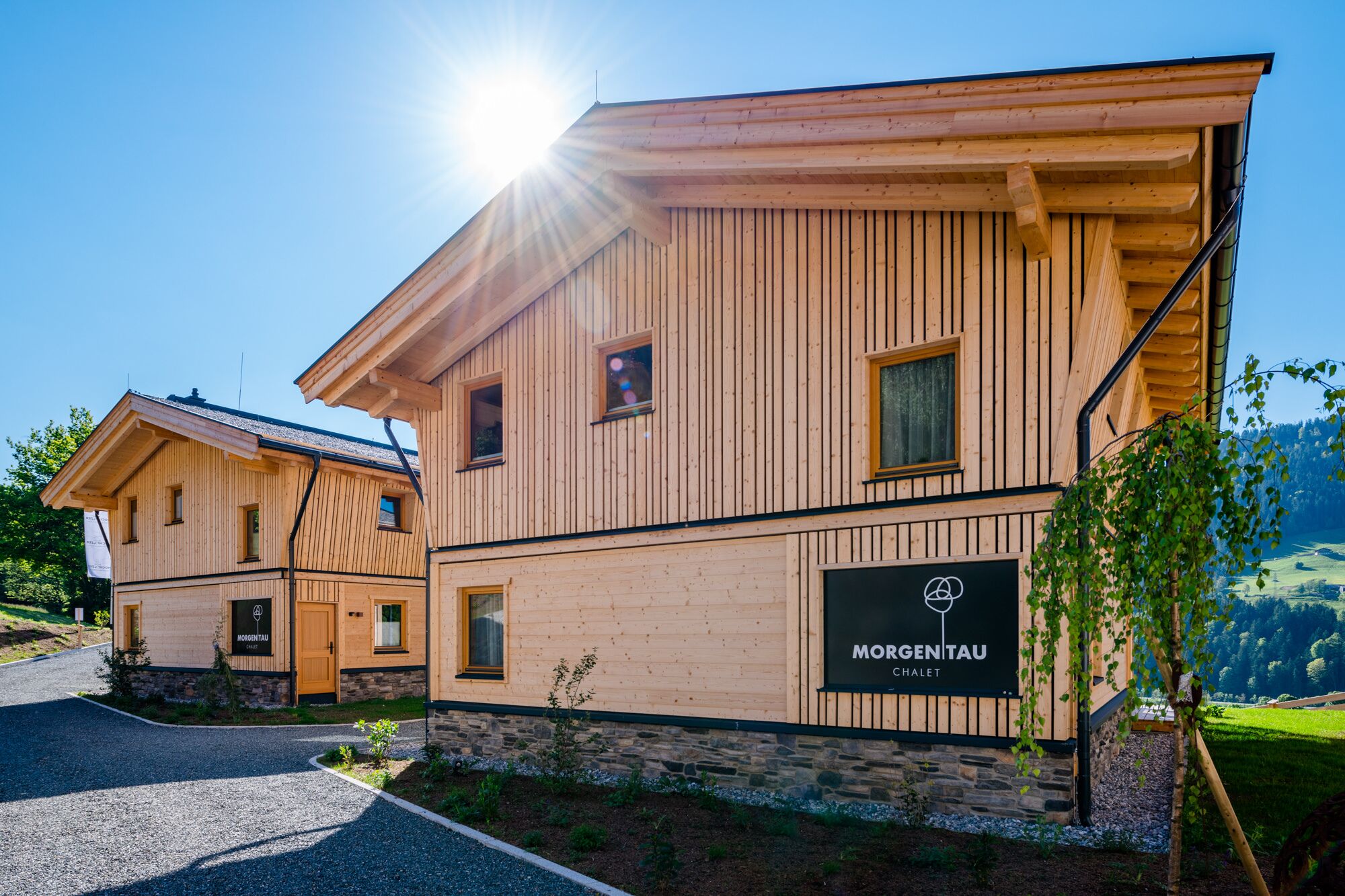 A wooden building with a sign reading "Morgentau Chalet".