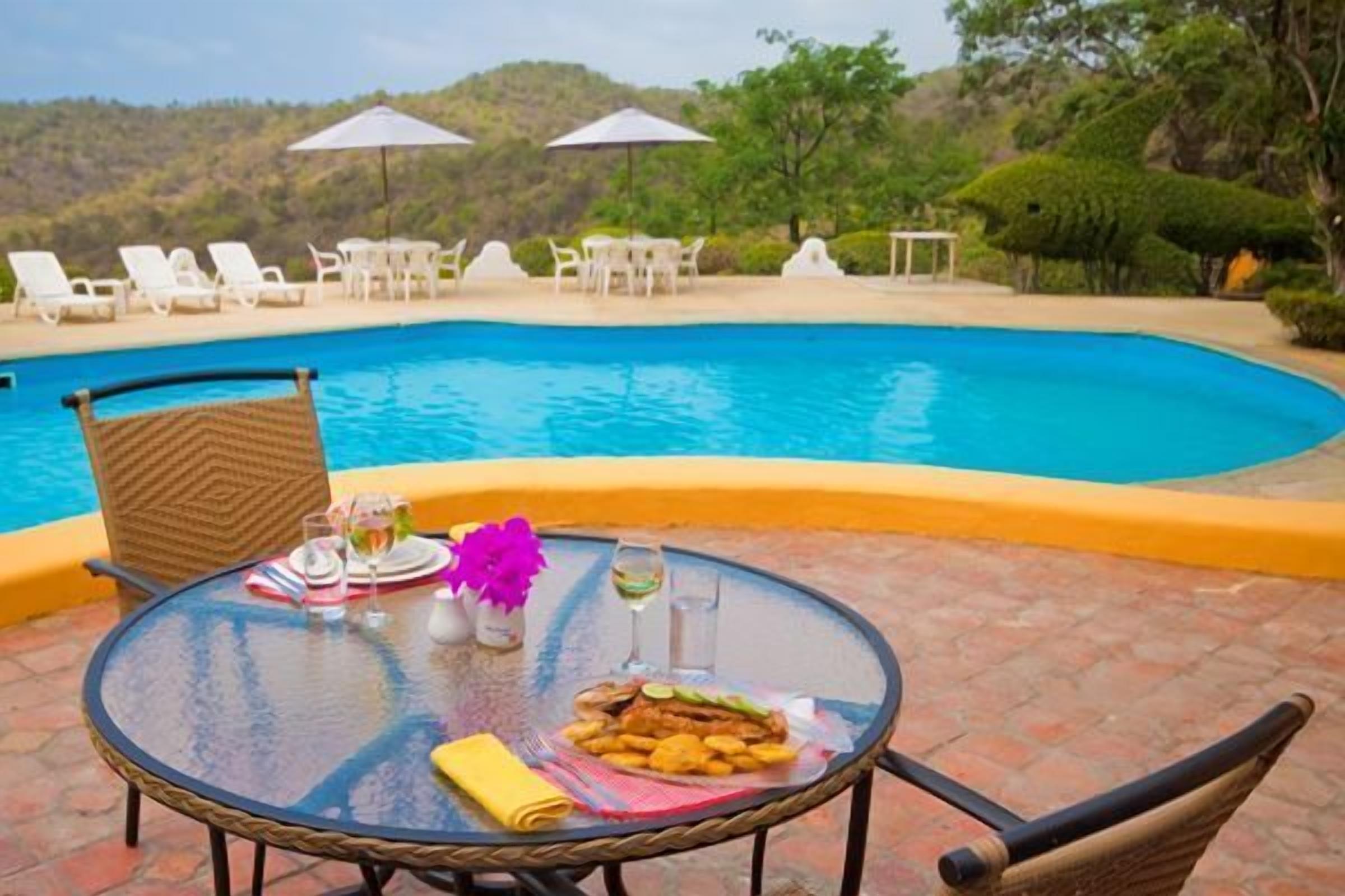Breakfast, lunch, dinner served; pool views