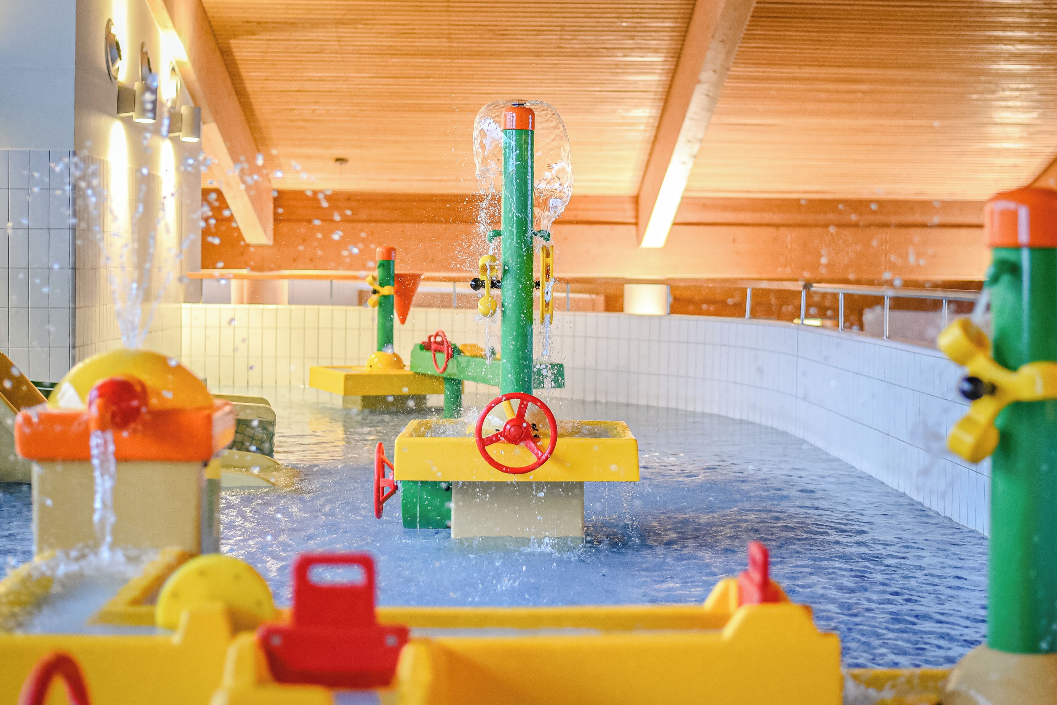 A water play area with various water features and play structures.