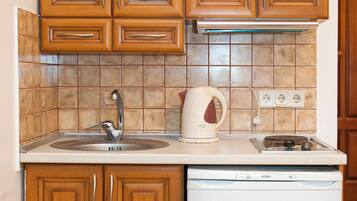 Suite, 2 Bedrooms | Private kitchenette | Full-size fridge, microwave, stovetop, coffee/tea maker