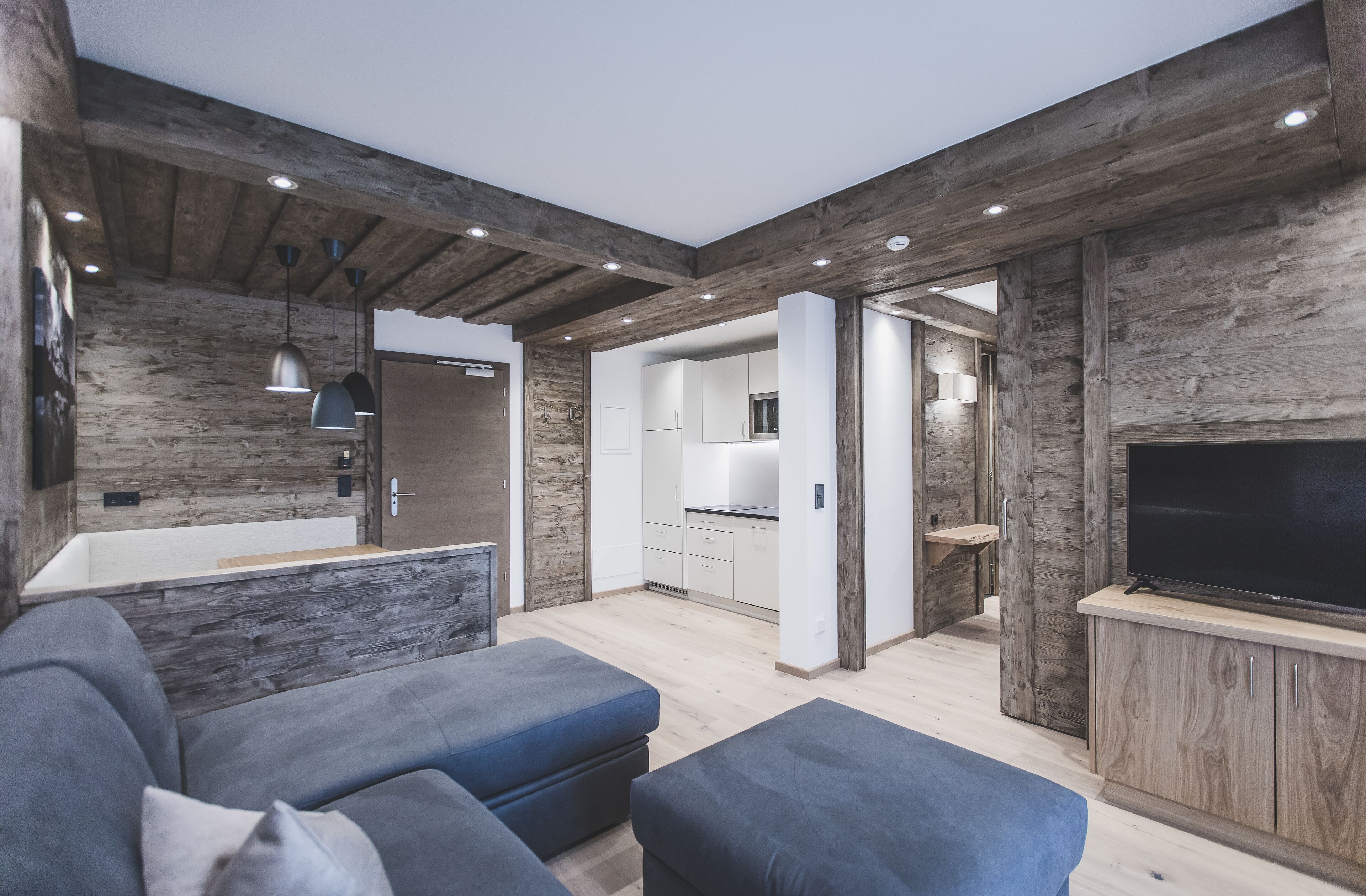 Exclusive Apartment, 1 Bedroom, Mountain View, Poolside | Living area | 42-inch flat-screen TV with satellite channels, TV, heated floors