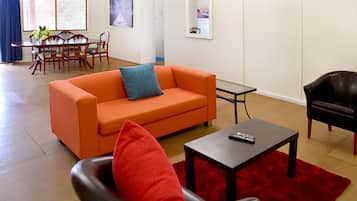 Economy Apartment, 1 Bedroom | Living area | Flat-screen TV, DVD player