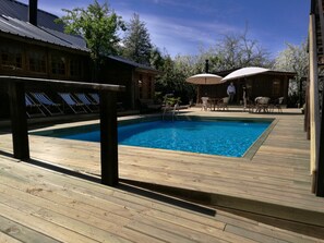 Seasonal outdoor pool, pool umbrellas, sun loungers