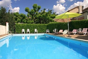 Outdoor pool, open 8:00 AM to 8:00 PM, pool umbrellas, pool loungers