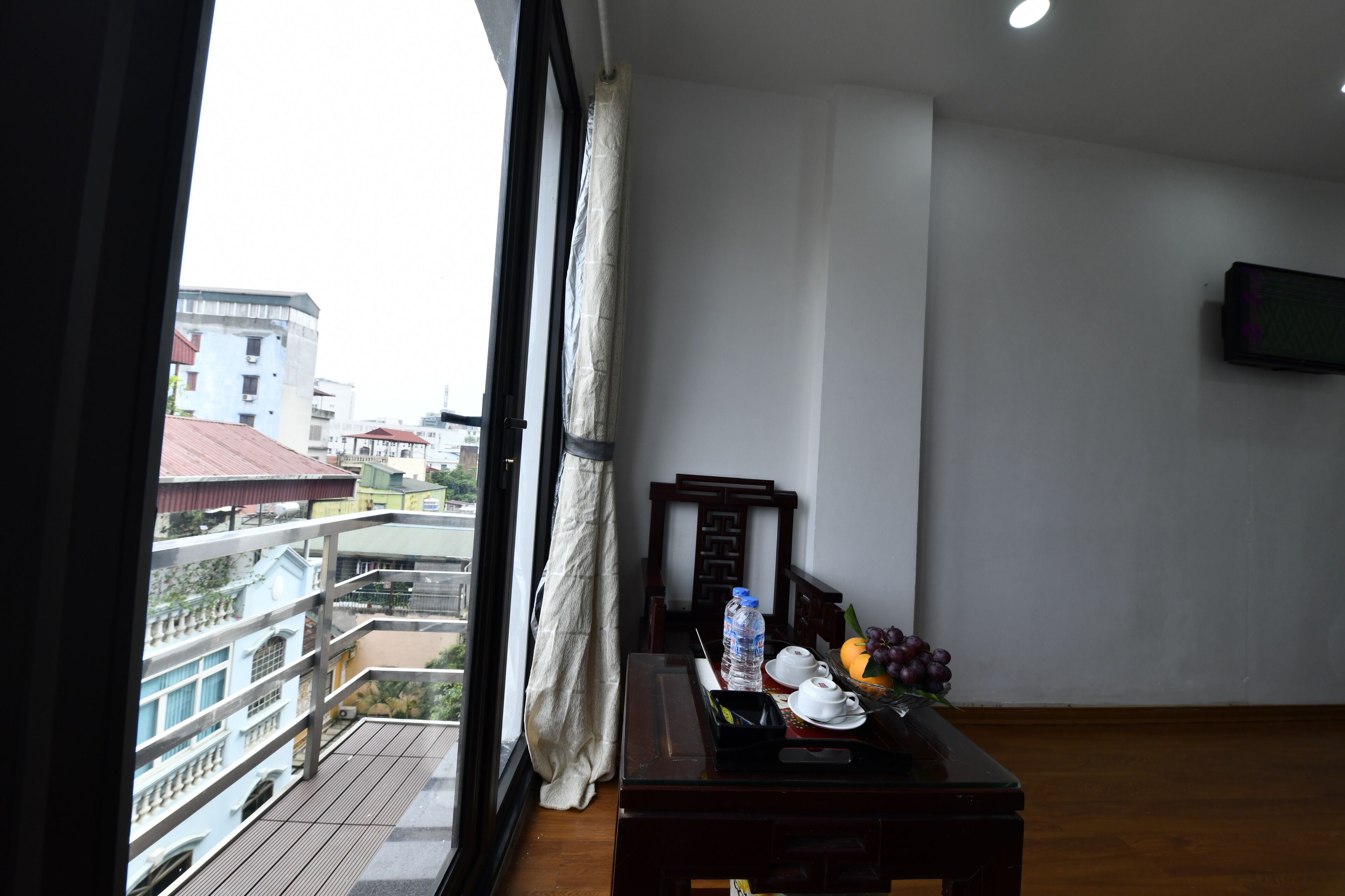 deluxe double room, balcony, city view | minibar, in-room safe, desk, laptop workspace