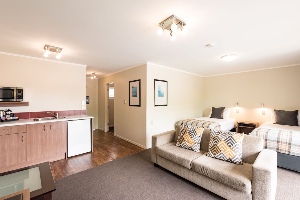 one bedroom family garden | living area | 55-inch smart tv with digital channels, tv, streaming services