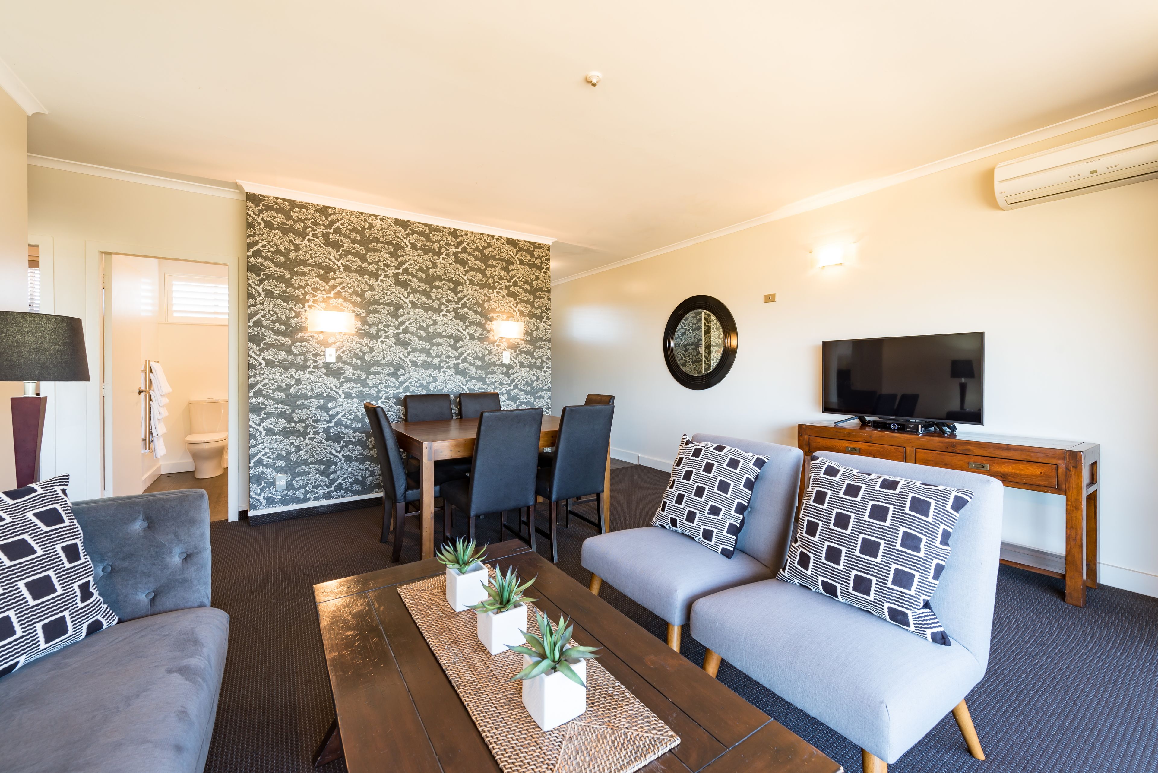 premium deluxe lakeview two bedroom | living room | 55-inch smart tv with digital channels, tv, streaming services