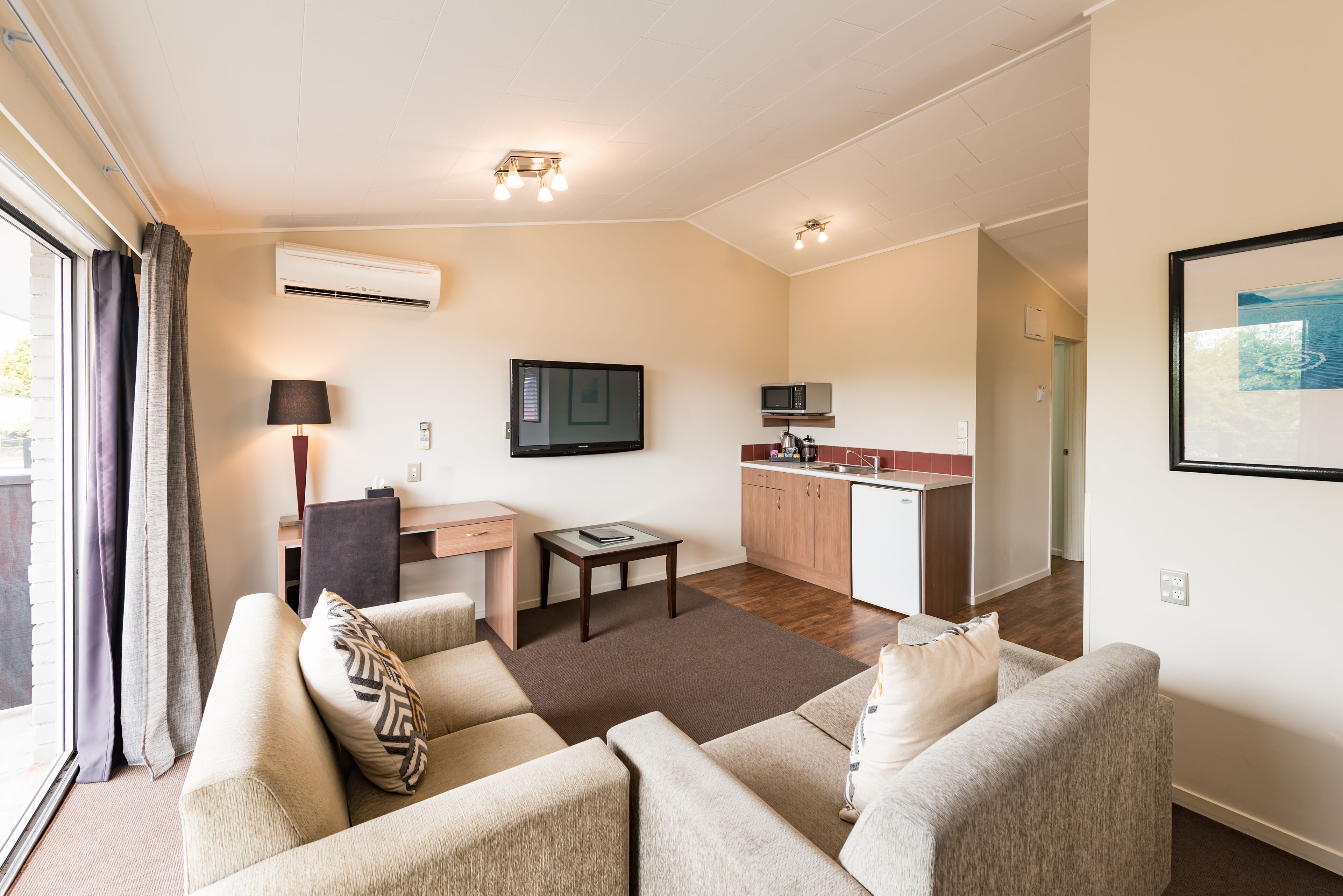 one bedroom family garden | living area | 55-inch smart tv with digital channels, tv, streaming services