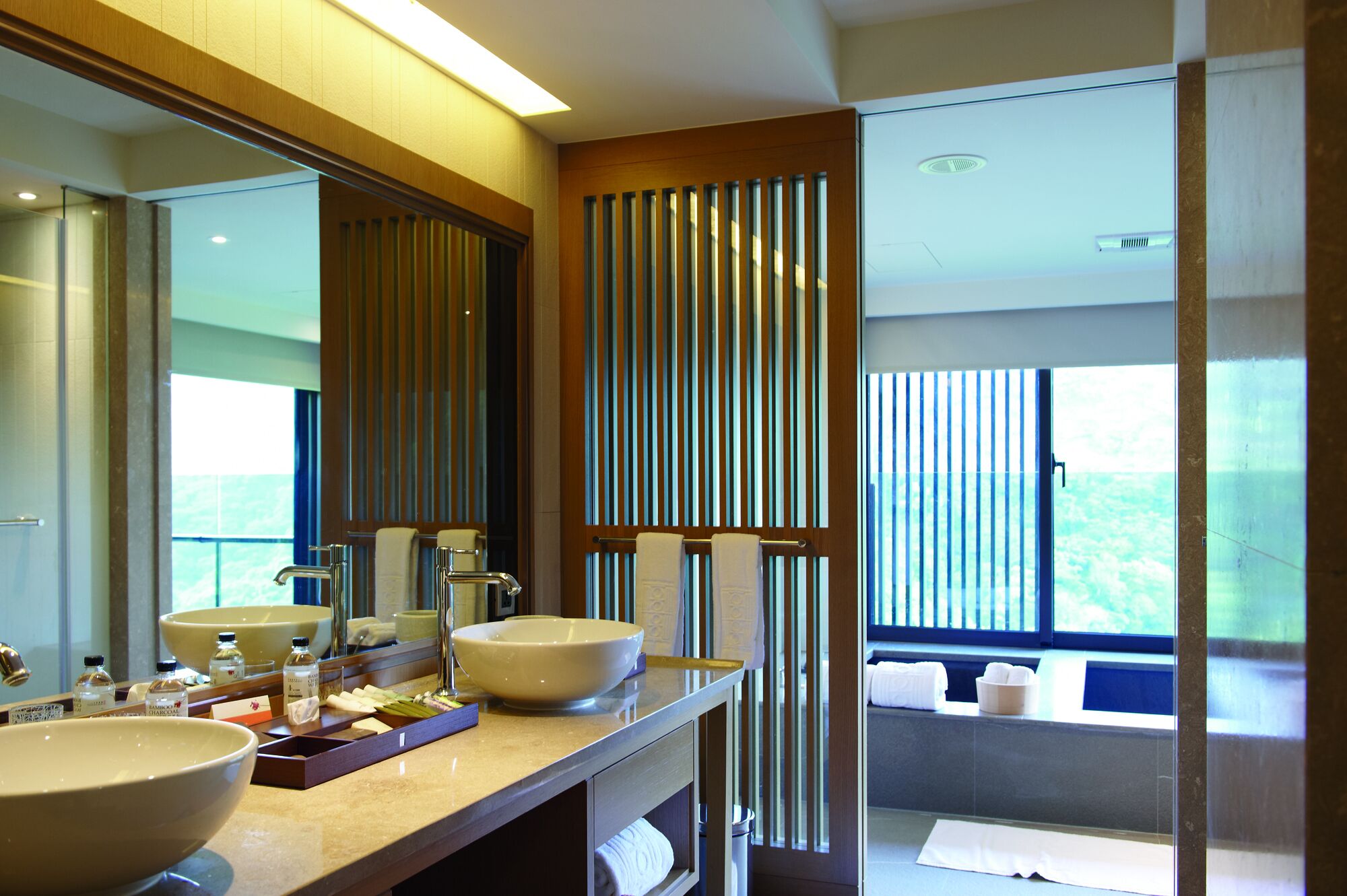 deluxe family room | bathroom | separate bathtub and shower, deep-soaking bathtub, rainfall showerhead