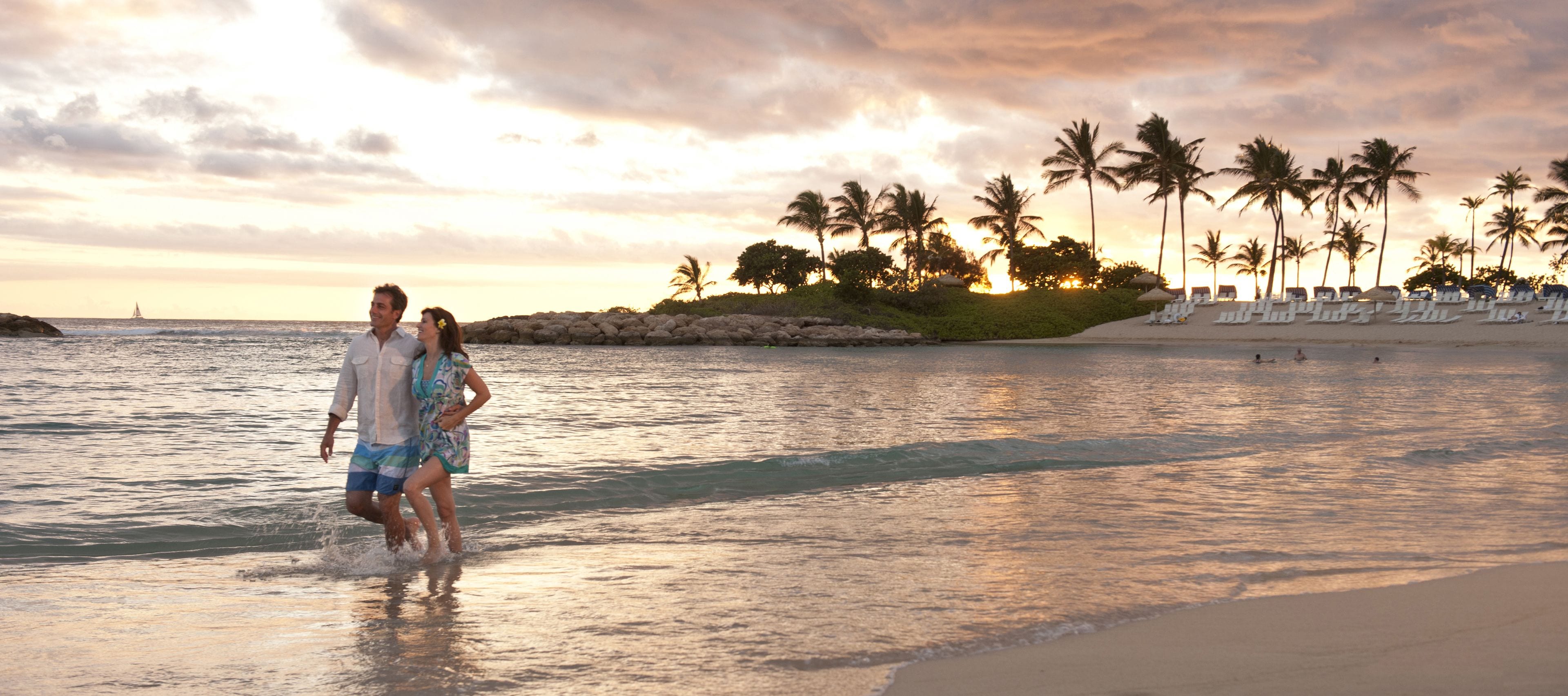 On the beach, white sand, sun loungers, beach umbrellas