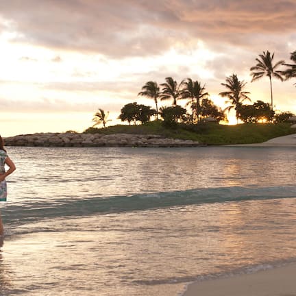 On the beach, white sand, sun loungers, beach umbrellas