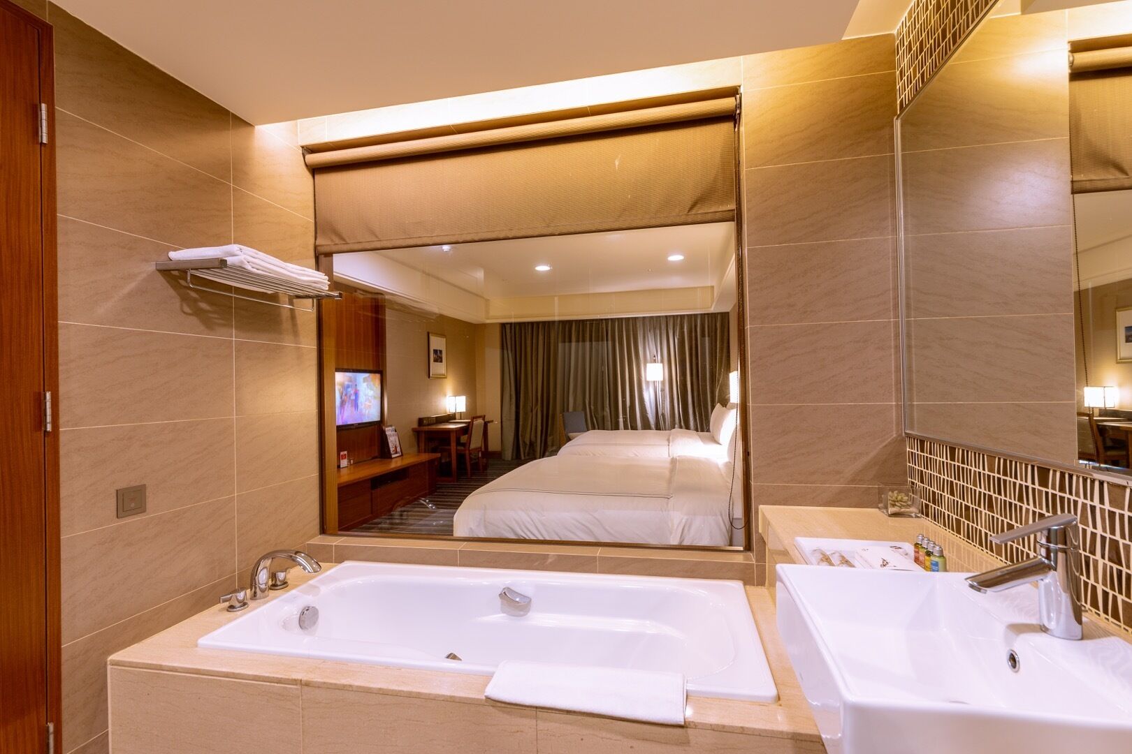 rainfall showerhead, hair dryer, slippers, towels