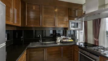 Three Bedroom Family Suite with free Minibar (One time) | Private kitchenette | Fridge, coffee/tea maker, electric kettle