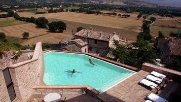 Seasonal outdoor pool, pool umbrellas, pool loungers