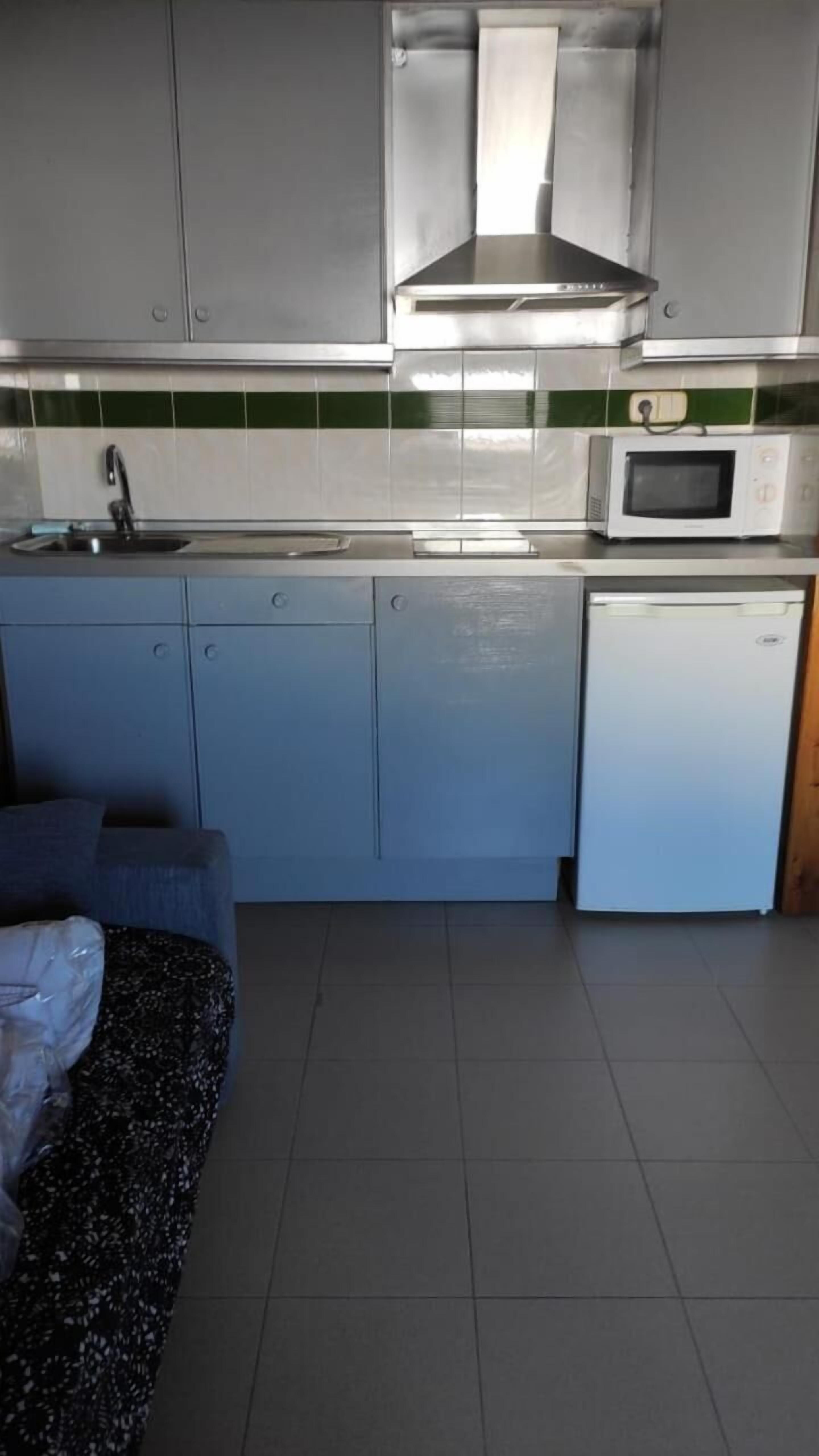 Full-sized fridge, microwave, stovetop, coffee/tea maker