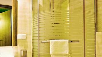 Separate bathtub and shower, hair dryer, towels