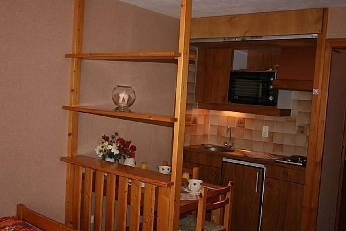 mini-fridge, stovetop, coffee/tea maker, cleaning supplies