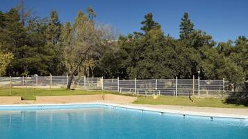 Seasonal outdoor pool, open 11:00 AM to 8:00 PM, pool umbrellas