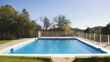 Seasonal outdoor pool, open 11:00 AM to 8:00 PM, pool umbrellas