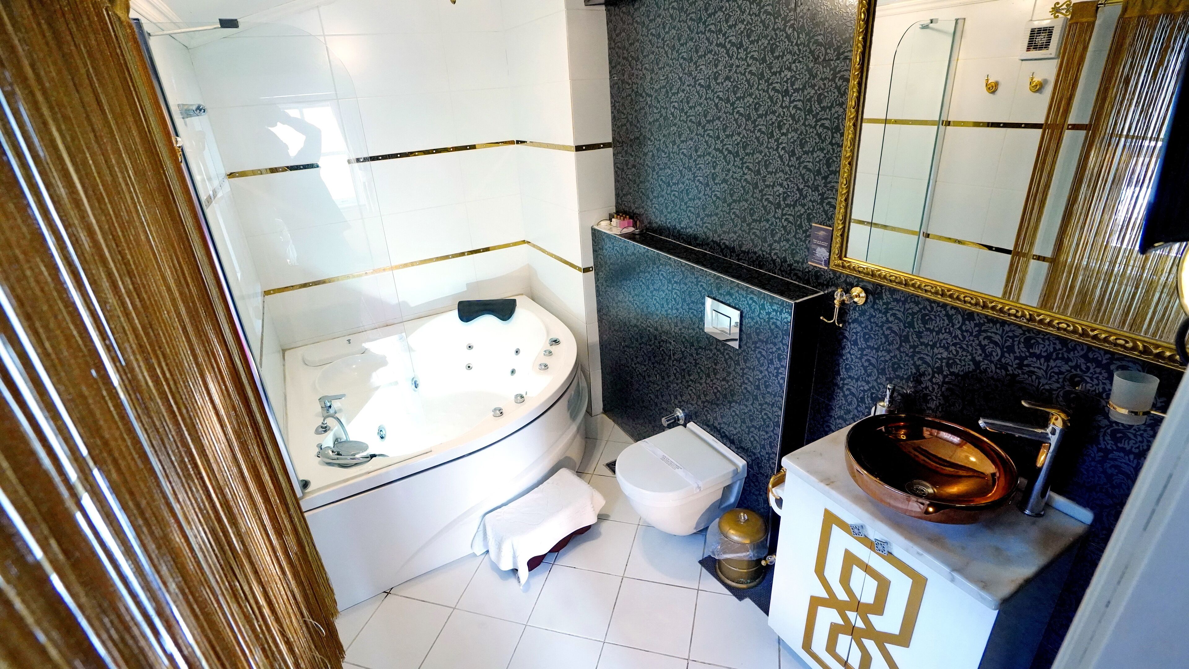 shower, designer toiletries, hair dryer, slippers