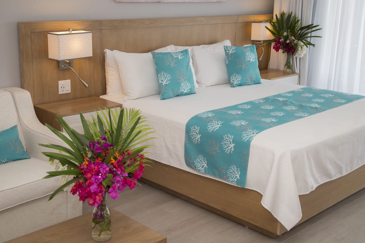 junior studio suite, 1 king bed with sofa bed, garden view | 1 bedroom, in-room safe, desk, laptop workspace