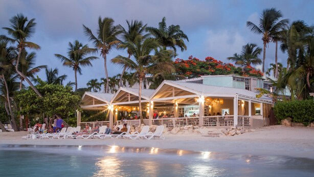 A beachfront resort with multiple lounge areas and a pool. - Siboney Beach Club (St. John's)