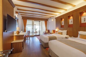 A hotel room with two beds, a desk, a TV, and a window with curtains. - Club Himalaya by ACE Hotels, Nagarkot  (Baluwapati Deupur)