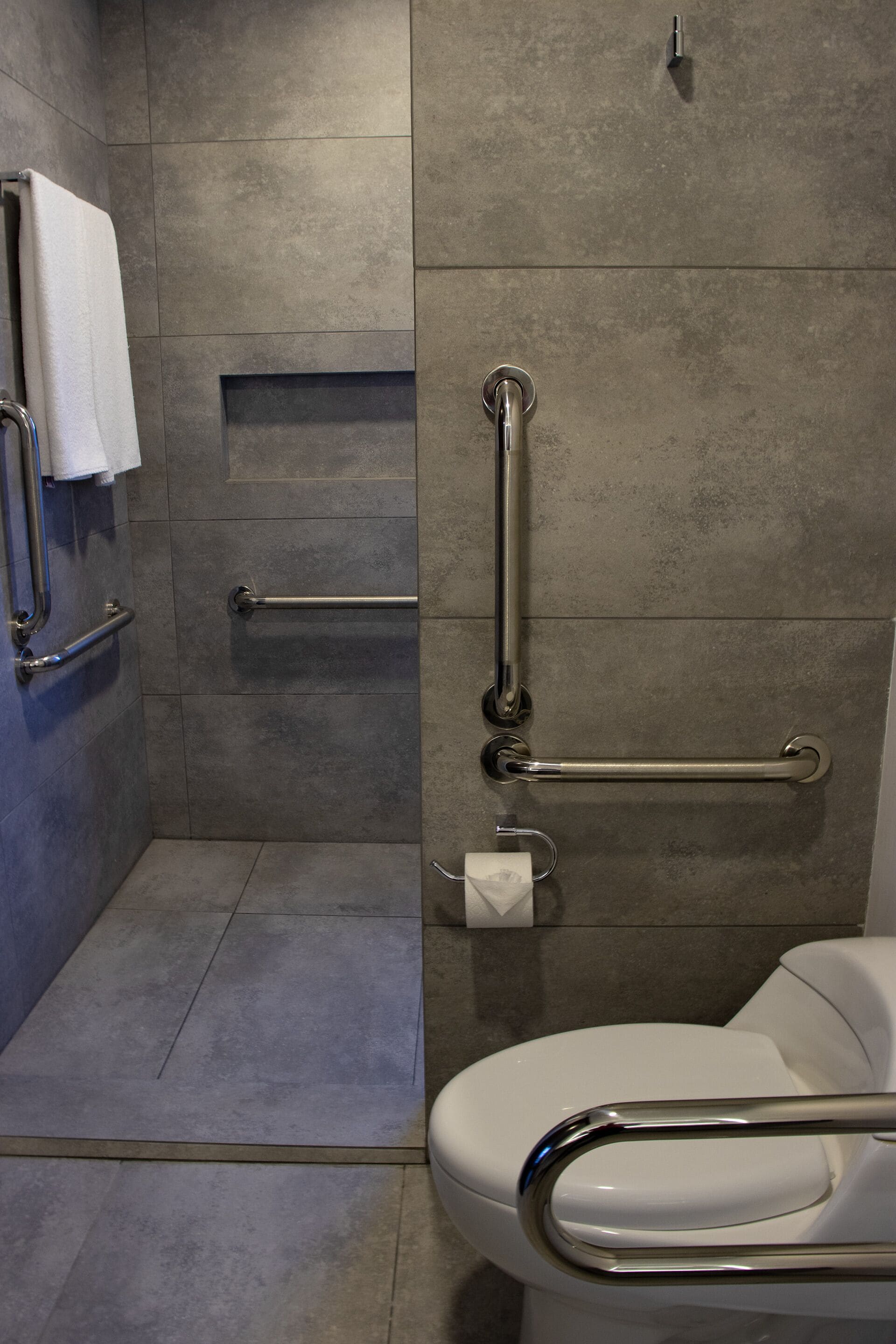 junior studio suite, city view | bathroom | shower, free toiletries, hair dryer, towels